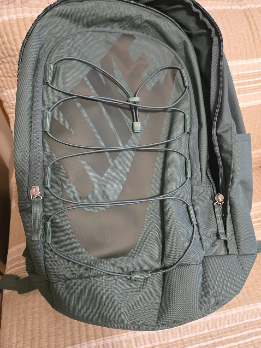 dark green nike backpack Hayward Backpack, Bicoastal/Vintage Densely woven polyester fabric Large main compartment and internal organization pockets Fits most 15 laptops Adjustable shoulder straps Top haul loop Front bungee system with cinch easily stores jackets Chest strap Side pockets for water bottle storage 19 H x 13 W x 9 D 26L capacity 100% polyester The Nike Hayward Backpack (26L) is imported Green Backpacks.
